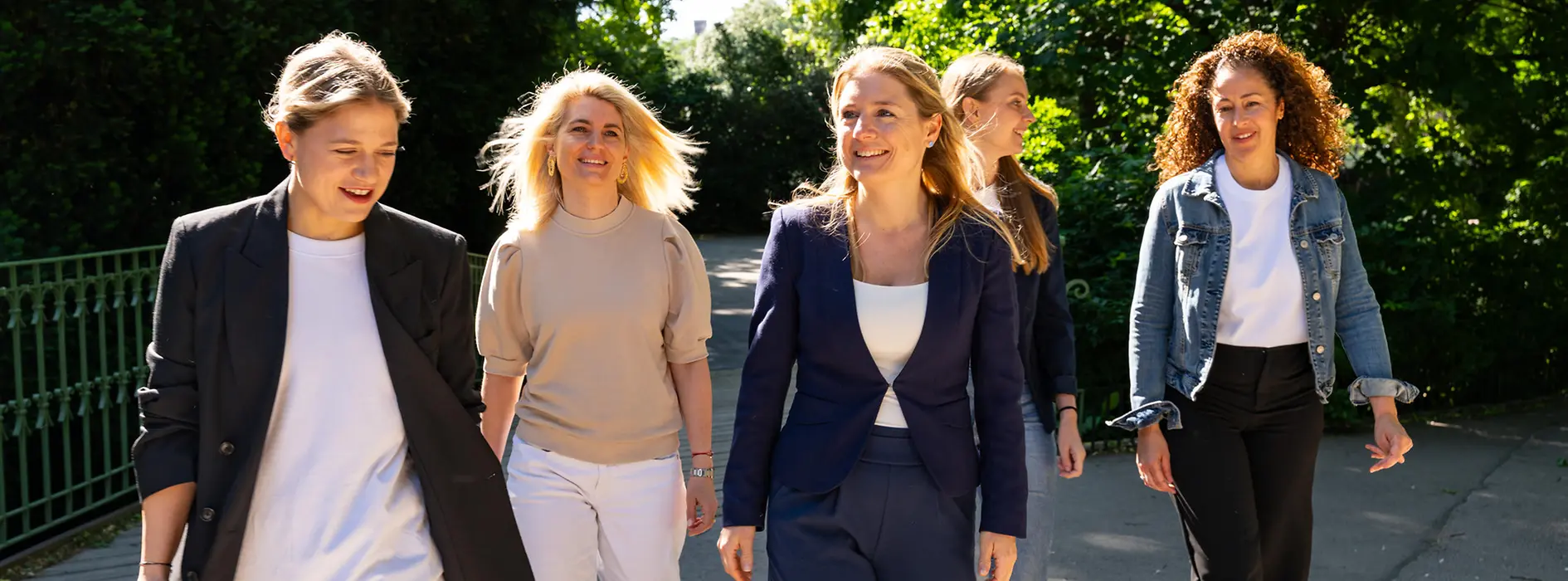The five members of the VECI team are going for a walk in the city park